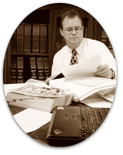 Photo of Jeff Kessel working tirelessly on an auditing assignment