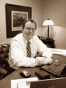 Photo of Jeff Kessel at his desk in his office