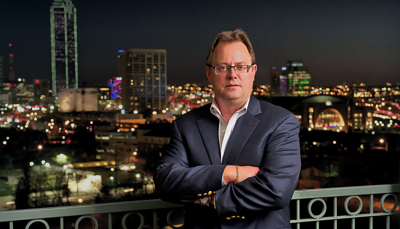 Photo of Jeff Kessel in front of the Dallas skyline
